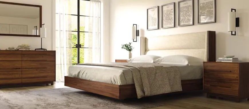 Tidy bedroom with fresh linen and a wooden bed frame